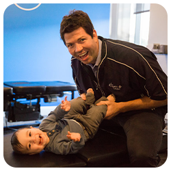 Chiropractor Grand Rapids MI Matthew Phinney Adjusting Child