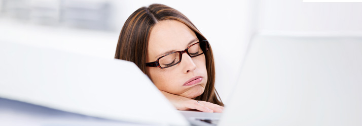 Chiropractic Grand RApids MI Woman Falling Asleep at Desk